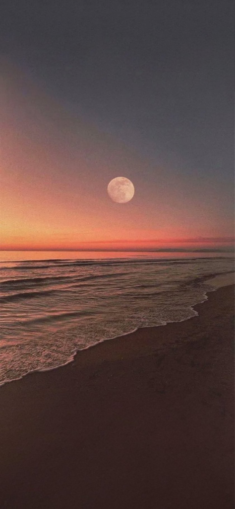 Fondo de pantalla de la luna junto al mar para celular