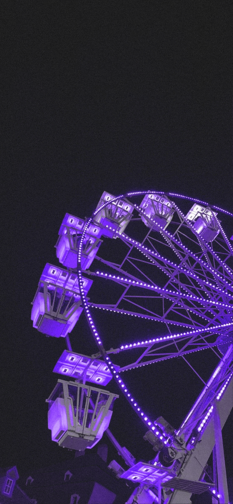 fondo de pantalla morado con negro de un parque de diversiones